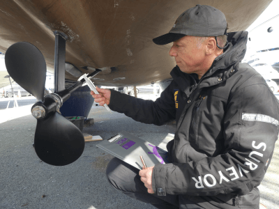 marine surveyor inspecting propeller