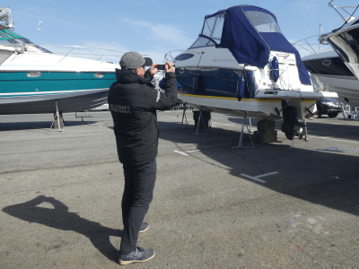 marine surveyor taking photos